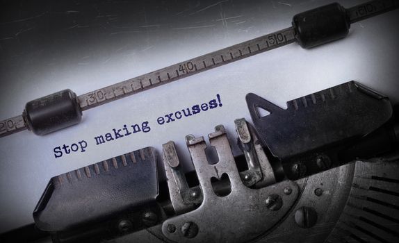 Vintage inscription made by old typewriter, Stop making excuses