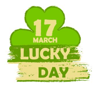 17 March lucky day - text in green drawn banner with four leaved shamrock symbol, holiday seasonal concept