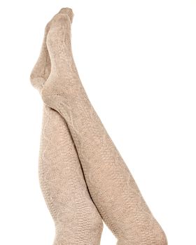 Female legs in knitted socks, white background, isolated