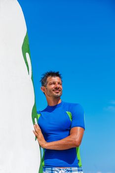 Father holding son on his shoulders at the beach