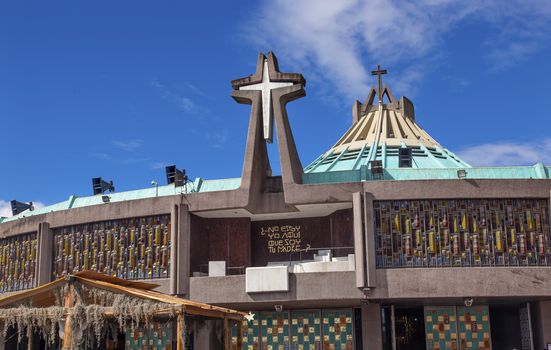 New Basilica Christmas Creche Shrine of the Guadalupe Mexico City Mexico. Also known as Basilica de Nuestra de la Senora Guadalupe.  Basilica construction was started in 1972, finished 1974.  This basilica is the location where the Virgin Mary appeared to the Meixcan peasant Juan Diego and where Juan Diego's original cloak with the picture of the Virgin Mary is located.  