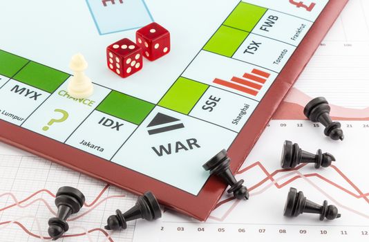 Stock market board game with white piece places on chance area and black pieces fall on graph background