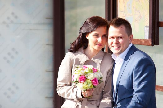 beautiful bride and groom with bouquet