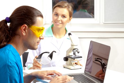 group of scientists working at the laboratory