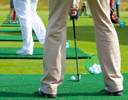 golfer ready to tee off on the golf field