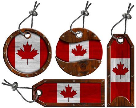 Four wooden labels with Canadian flags with steel cable. Isolated on white background