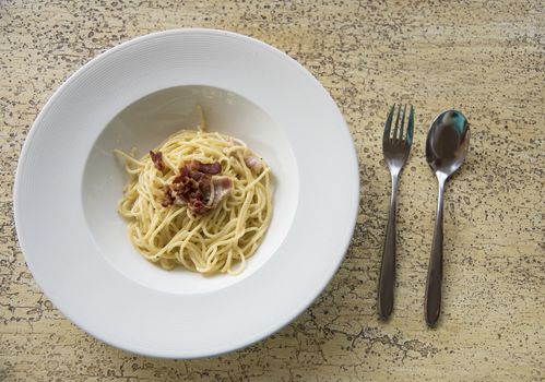 Spaghetti with becon on table, Cuisine