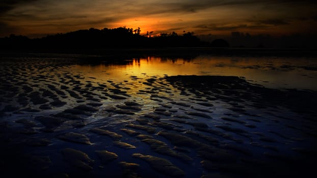 Nice sunset sky and sea at low tide in Payam island, Thailand