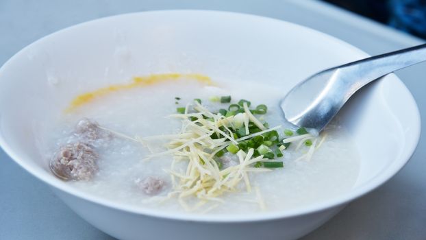 Rice gruel cooked together with soup and pork 