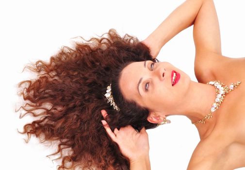 beautiful young girl lying with her hair on a white background