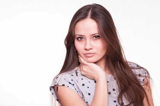 Portrait of a beautiful young woman of the European type on a white background