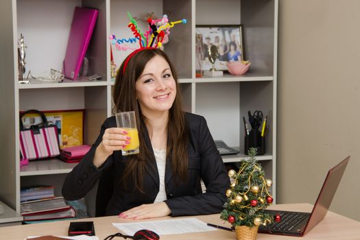 Cute business woman in the office at the computer