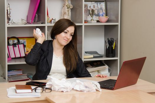 Cute business woman in the office at the computer