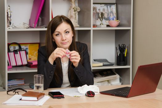 Cute business woman in the office at the computer