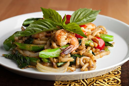 Thai food shrimp stir fry with lo mein noodles Shallow depth of field.
