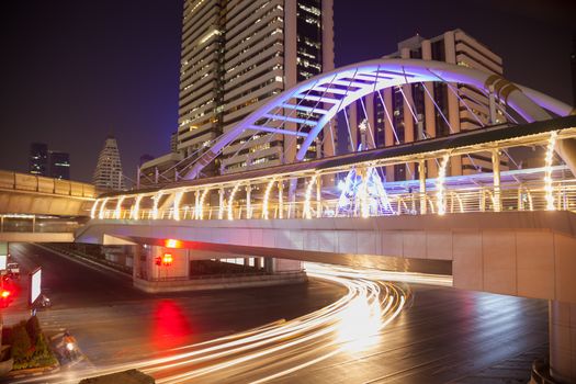 Silom Road intersection. Bridge crossing the junction of Silom in Bangkok in the evening.