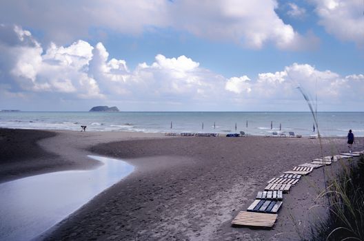 wooden path crossing the sandy  beach