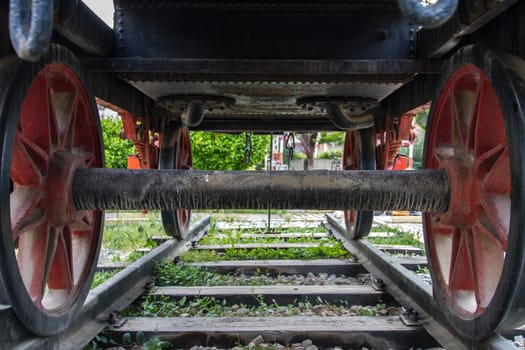 Back and bottom view of train on railway in museum.