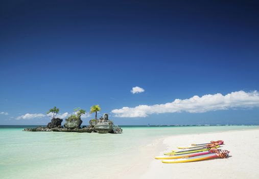 white beach and christian shrine and paddle boats on boracay tropical island in philippines asia