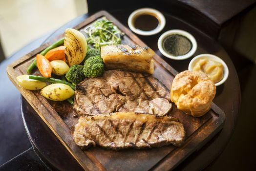 traditional english food sunday roast lunch in cozy restaurant pub