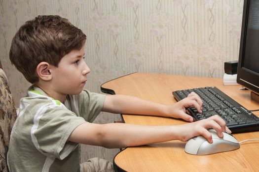 little boy running on the computer