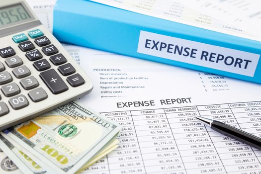 Financial expense report with banknotes and calculator