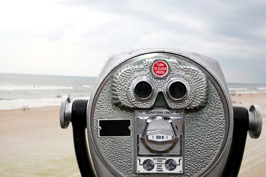 Look through the binoculars to see the beautiful surf and sand beyond.