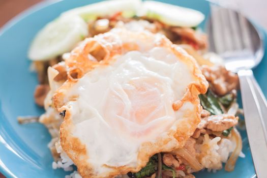 Basil fried rice with pork and fried egg, stock photo