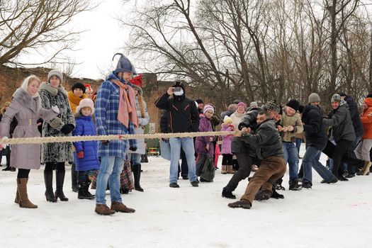 Tug of war during winter Maslenitsa 2015, carnival in Russia