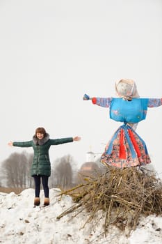 Girl with Kostroma or straw Lady Maslenitsa during winter Maslenitsa 2015,  carnival in Russia