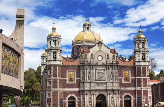 New and Old Basilica Christmas Creche Shrine of the Guadalupe Mexico City Mexico. Also known as Templo Expiatorio a Cristo Rey.  Basilica construction was started in 1531, finished in 1709.  This is the basilica is the location where the Virgin Mary appeared to the Meixcan peasant Juan Diego.  The old Basilica is where Juan Diego's original cloak with the picture of the Virgin Mary first appeared. 