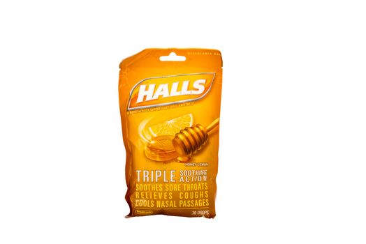 Winneconne, WI - 7 February 2015: Bag of Halls cough drop's honey lemon flavored.