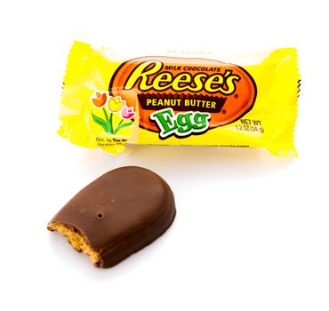 Winneconne, WI - 21 February 2015:  Single package of Reese's peanut butter cup shaped in form of an egg with a bit out of it.