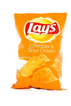 Winneconne, WI - 3 February 2015: Bag of 10 OZ Frito Lay Cheddar & Sour Cream potato chips. Frito-Lay is the worlds largest distributed snack food.