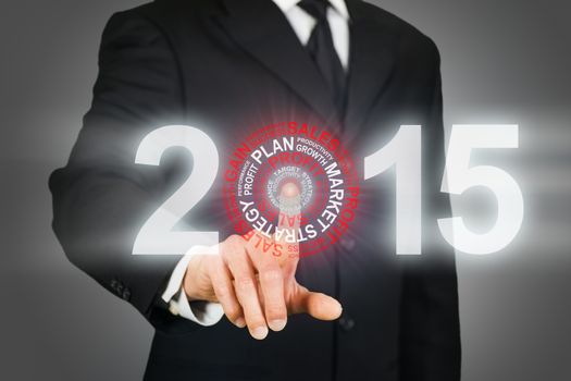Businessman clicking on 2015 business target