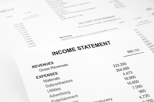 Income statement reports with detail list of revenues and expenses for business accounting concept, black and white tone image