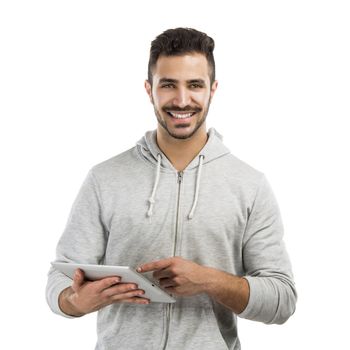 Good looking latin man working with a tablet