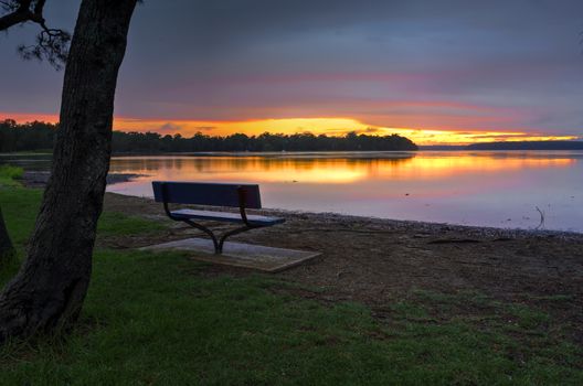 Even rainy days can be beautiful at Paradise Beach Reserve on foreshores of St Georges Basin as the sun goes down behind the clouds..  Basin walk will take you along much of its winding foreshore.