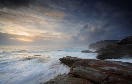 Turbulent ocean currents build unabated like unbridled passions washing over steadfast rocks that do not surrender  but stands firm.   Little Bay, NSW Australia