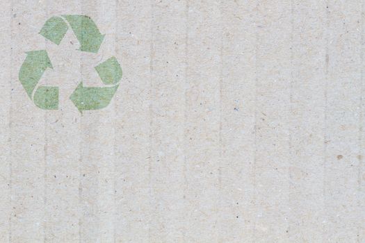 close-up Grey cardboard Paper Background with detail texture, macro, with symbol of recycle on the upper corner