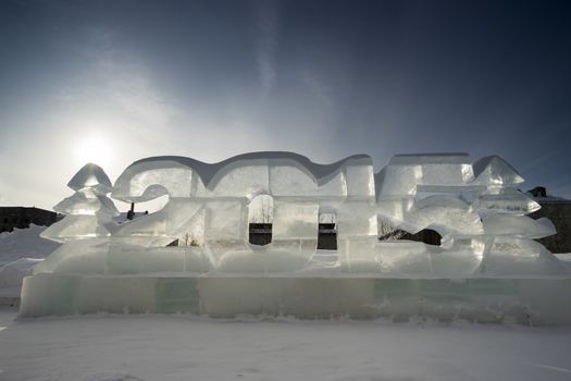 Two Christmas trees and figures of the New 2015 made of ice.