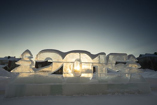 Two Christmas trees and figures of the New 2015 made of ice.