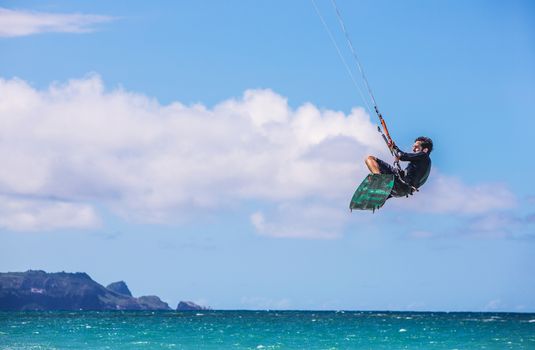 KAHULUI, HI /USA - AUGUST 30: California kite surfer Robert Blum practicing off Kanaha Beach on August 30, 2014 in Kahului, Maui, USA.