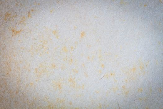 texture of old paper with yellow stain, background and vignette