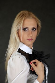 Beautiful young blond woman portrait looking at camera.