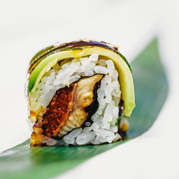 traditional fresh japanese sushi rolls on a white background