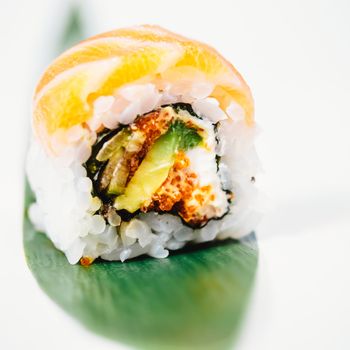 traditional fresh japanese sushi rolls on a white background