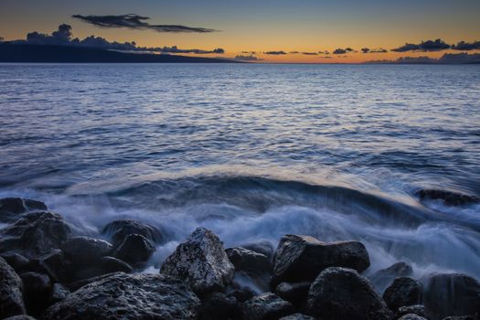 Waves crashing into beach on Maui Hawaii