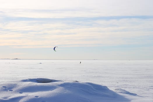 Kite surfing in the winter on the Gulf of Finland in Russia