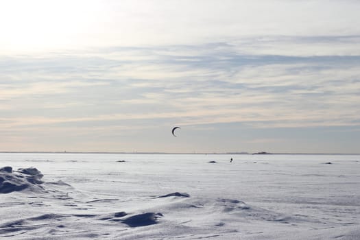 Kite surfing in the winter on the Gulf of Finland in Russia